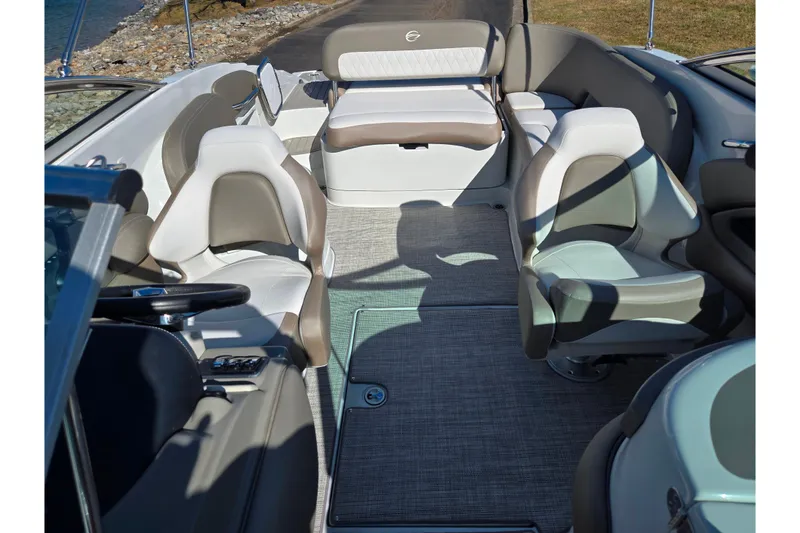 Slide: The Image of 2020 Crownline Eclipse E235 boat interior with plush seating and modern design. - 26