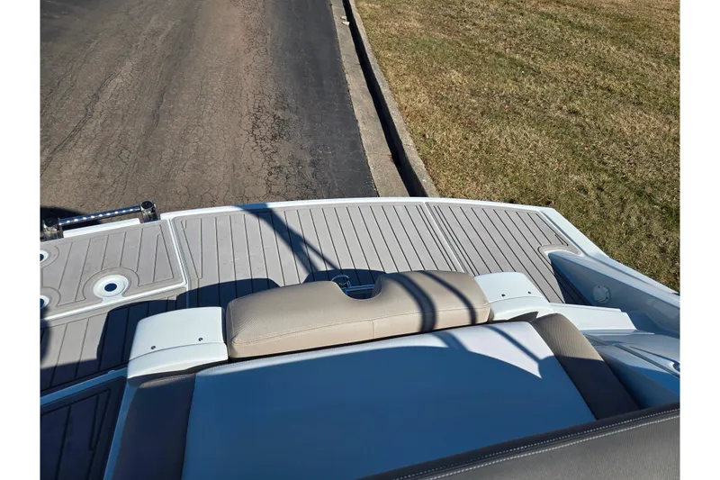 Slide: The Image of 2020 Crownline Eclipse E235 boat with sleek deck design and comfortable seating. - 29