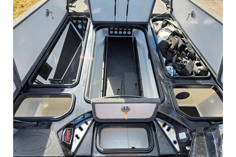 Slide: The Image of 2021 Ranger Z521L boat storage compartments open, showcasing organized interior space. - 15