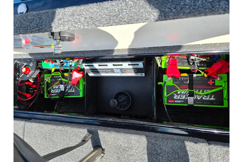 Slide: The Image of 2021 Ranger Z521L boat battery compartment with Tracker lithium batteries and wiring. - 23