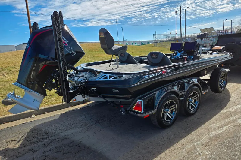Slide: The Image of 2021 Ranger Z521L boat with dual consoles and powerful outboard motor on trailer. - 3