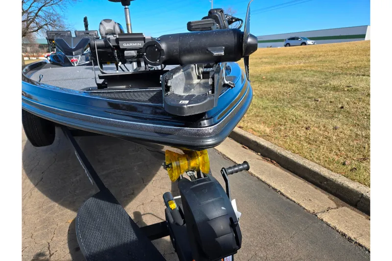 Slide: The Image of 2021 Ranger Z521L boat with Garmin equipment on a trailer, parked on a sunny day. - 6