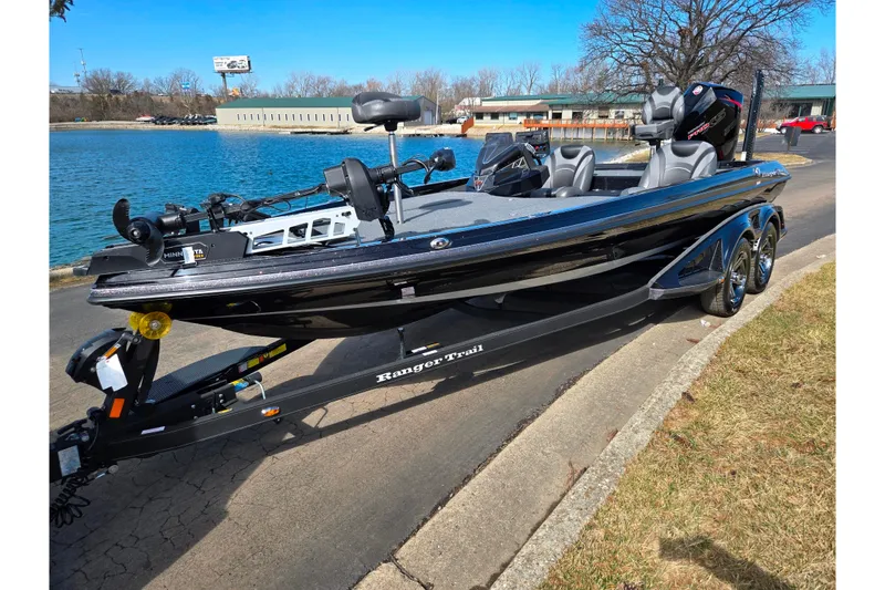 Slide: The Image of 2021 Ranger Z521L boat on trailer by a lake, sunny day. - 8