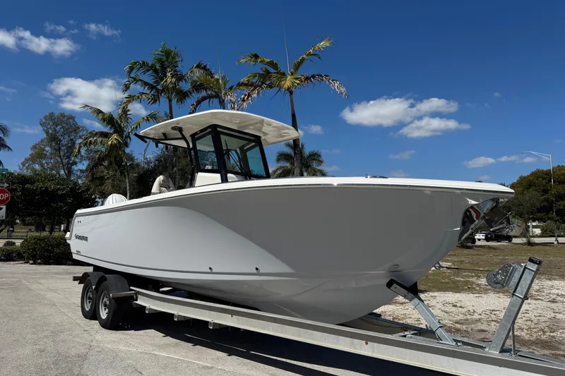 The Image of 2026 Sailfish 272 CC boat on trailer under clear blue sky. - 0