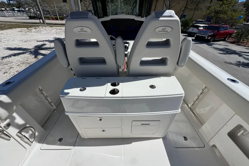 Slide: The Image of 2026 Sailfish 272 CC boat interior with dual seats and storage console. - 13