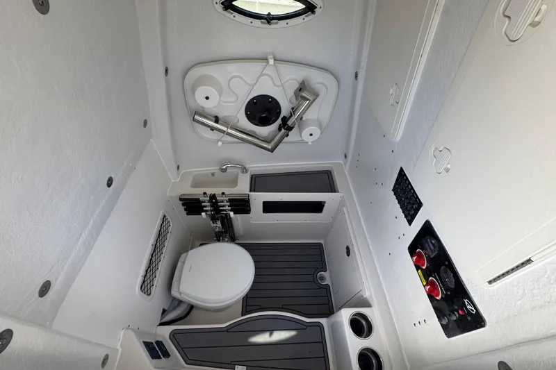 Slide: The Image of Interior of 2026 Sailfish 272 CC boat, featuring a compact marine bathroom setup. - 15