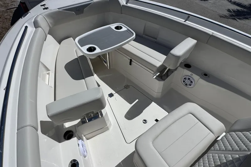 Slide: The Image of Interior of 2026 Sailfish 272 CC boat with seating and table setup. - 18