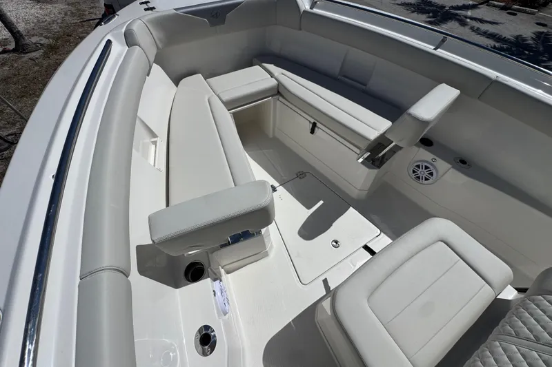 Slide: The Image of 2026 Sailfish 272 CC boat interior with cushioned seating and storage compartments. - 19