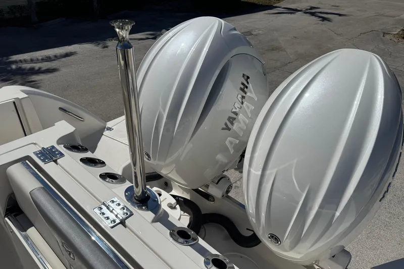 Slide: The Image of Sailfish 272 CC 2026 boat with dual Yamaha outboard engines, docked outdoors. - 4
