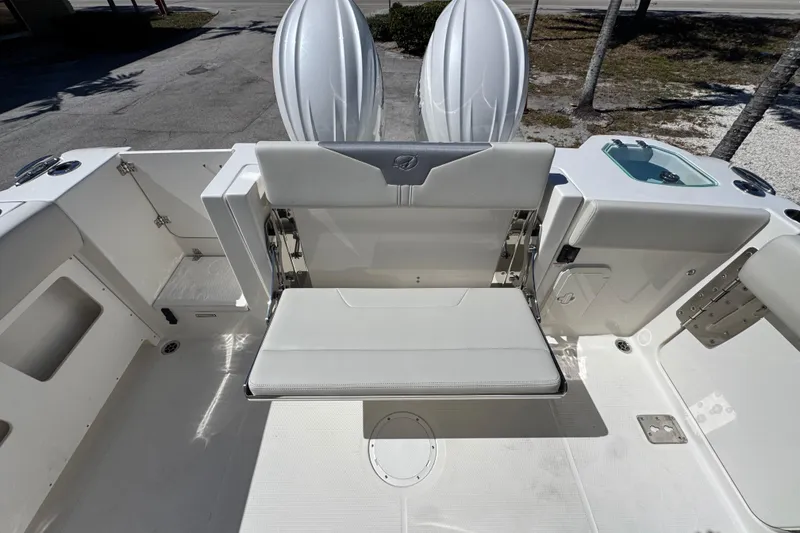 Slide: The Image of 2026 Sailfish 272 CC boat interior with foldable seating and storage compartments. - 5