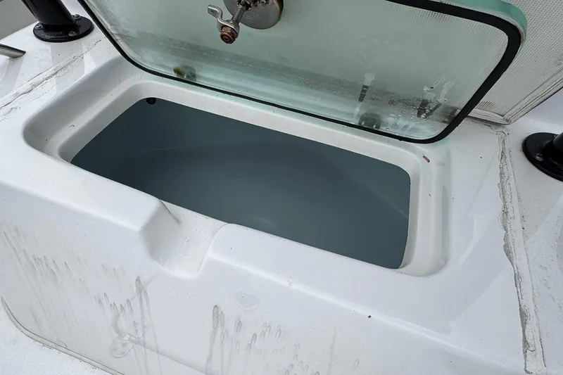 Slide: The Image of Open storage compartment on 2024 Cape Horn 32 XS boat. - 14