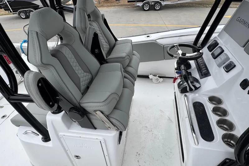 Slide: The Image of 2024 Cape Horn 32 XS boat interior with modern helm and seating. - 9