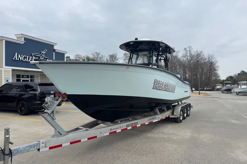 Slide: The Image of 2024 Cape Horn 32 XS boat on trailer at Angler's Marine dealership. - 1
