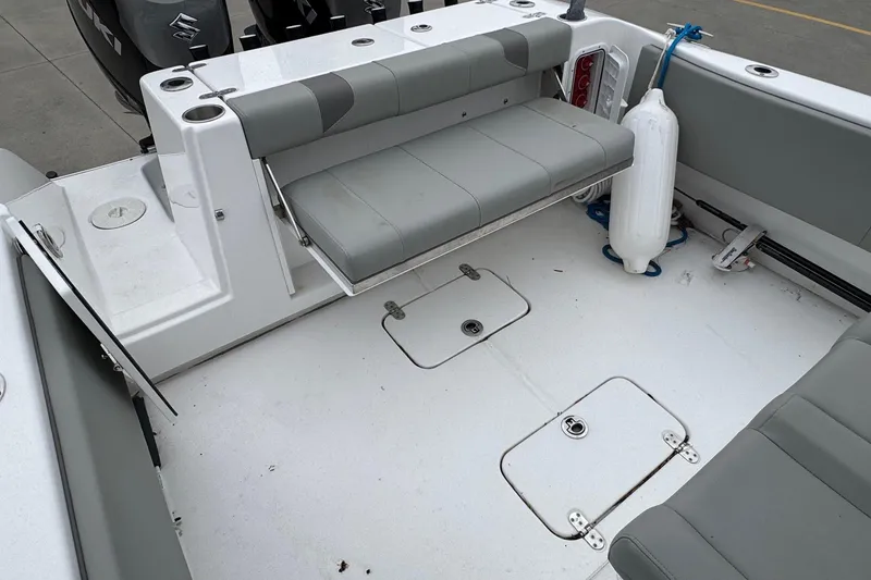 Slide: The Image of 2024 Cape Horn 32 XS boat interior with foldable seating and storage compartments. - 11