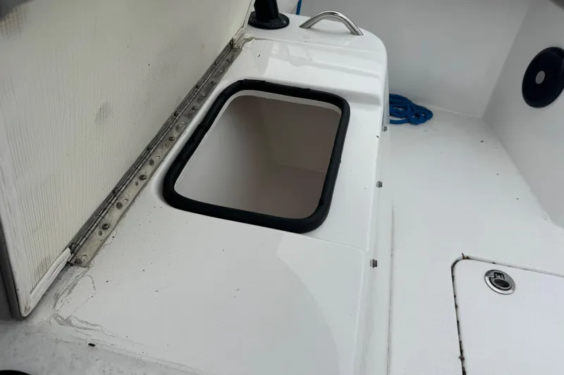 Slide: The Image of 2024 Cape Horn 32 XS boat interior with storage compartment and handle. - 13