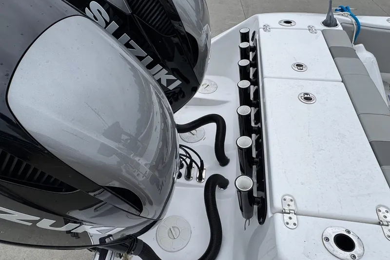 Slide: The Image of 2024 Cape Horn 32 XS boat with dual Suzuki engines and rod holders. - 17