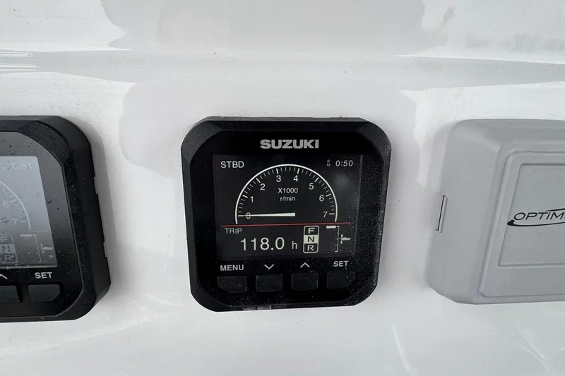 Slide: The Image of Suzuki display on 2024 Cape Horn 32 XS boat, showing trip details and RPM. - 23