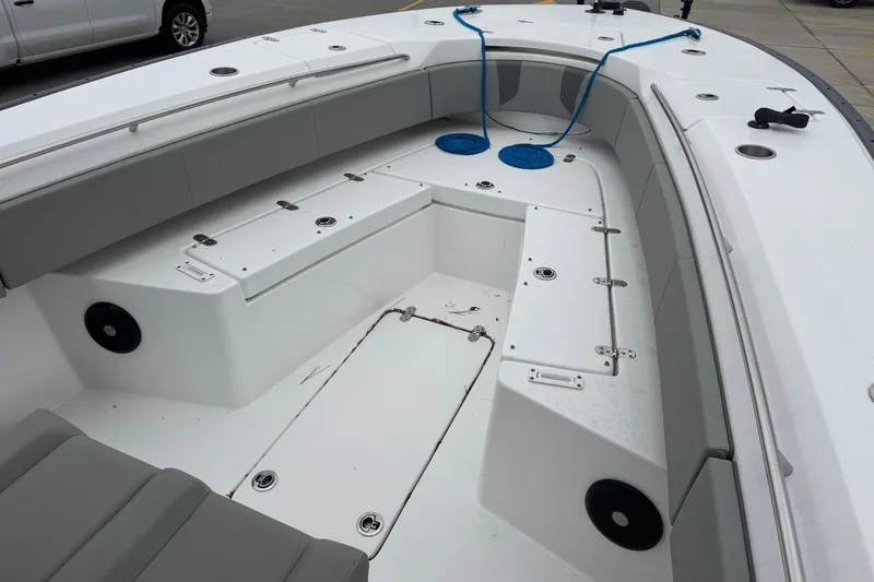 Slide: The Image of 2024 Cape Horn 32 XS boat interior with seating and storage compartments. - 25