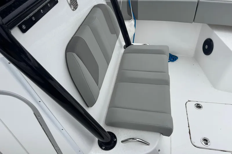 Slide: The Image of 2024 Cape Horn 32 XS boat interior with gray cushioned seating and sleek design. - 26