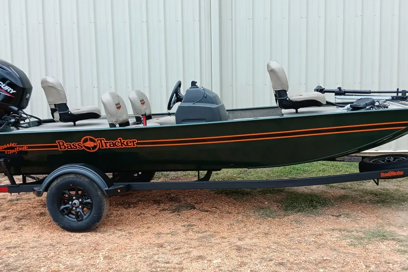 The Image of 2026 Tracker Bass Tracker Classic Limited fishing boat on trailer, side view. - 0