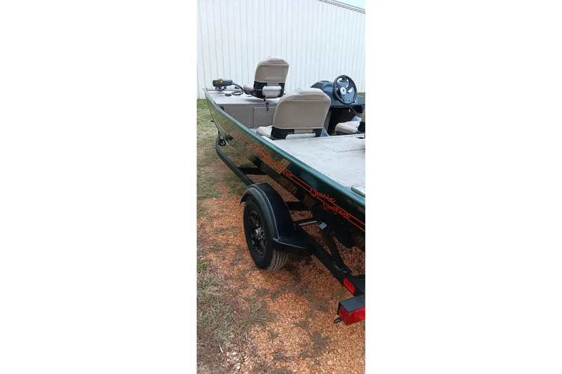 Slide: The Image of 2026 Tracker Bass Tracker Classic Limited boat on trailer, parked outdoors. - 5