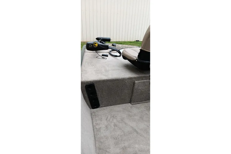 Slide: The Image of 2026 Tracker Bass Tracker Classic Limited boat interior with seating and controls. - 6