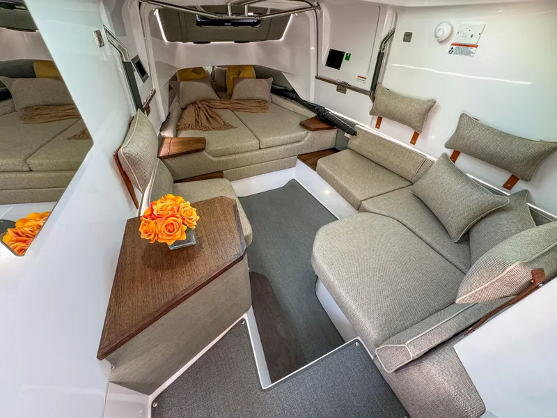 Slide: The Image of Luxurious interior of 2024 Axopar 37XC CROSS CABIN with modern seating and elegant decor. - 10