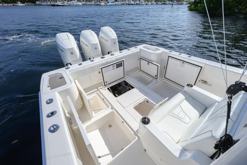 Slide: The Image of 2025 SeaVee 370Z boat with spacious deck and four powerful outboard engines. - 10