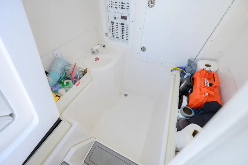 Slide: The Image of Interior of 2025 SeaVee 370Z boat with storage and safety equipment. - 12