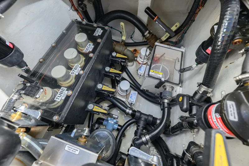 Slide: The Image of Engine compartment of 2025 SeaVee 370Z boat, showcasing complex wiring and components. - 14