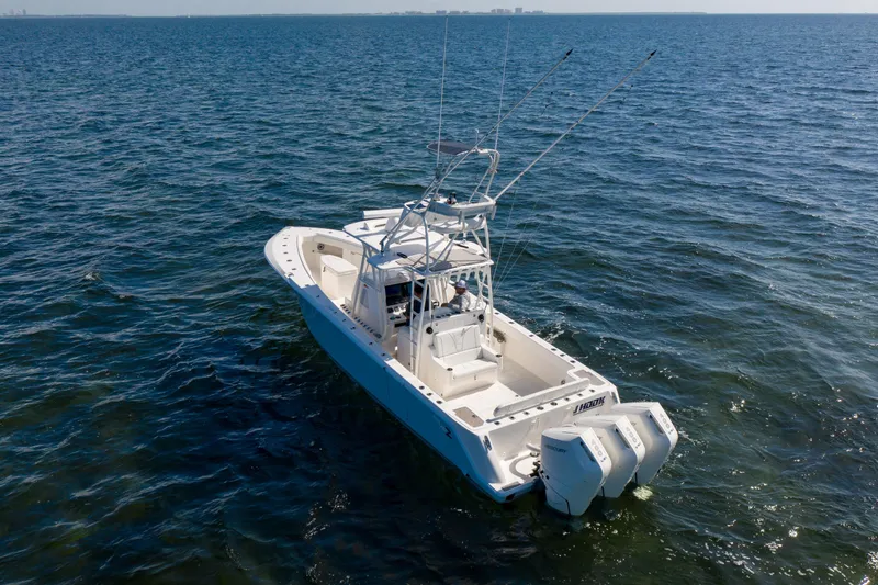 Slide: The Image of 2025 SeaVee 370Z boat on open water, featuring dual outboard engines. - 3