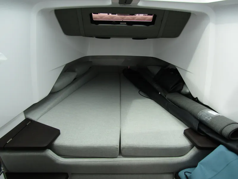 Slide: The Image of 2024 Axopar 37XC CROSS CABIN interior with spacious sleeping area and modern design. - 28