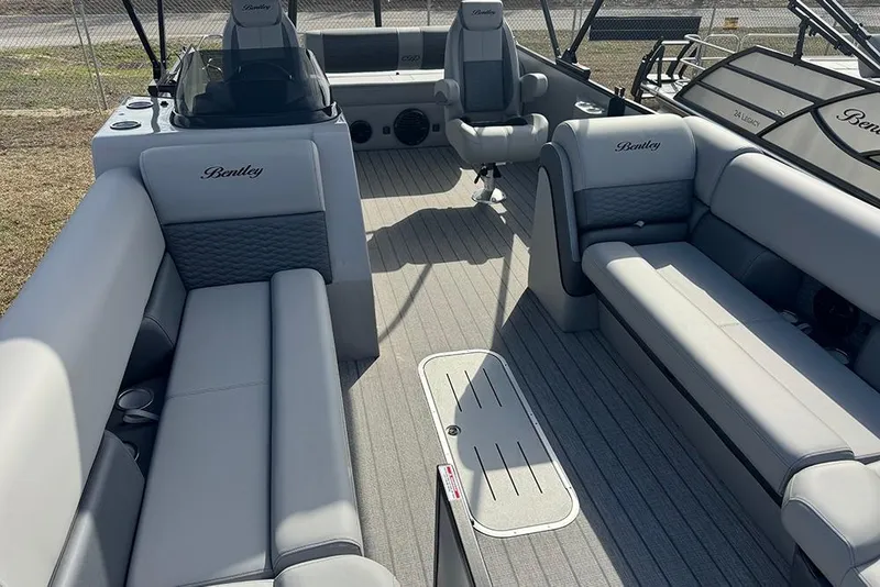 Slide: The Image of 2026 Bentley Pontoons Elite 253 Swingback Dual Captain Full Tritoon interior with luxurious seating. - 11