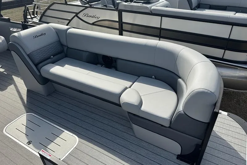 Slide: The Image of 2026 Bentley Pontoons Elite 253 Swingback Tritoon with luxurious seating and modern design. - 12