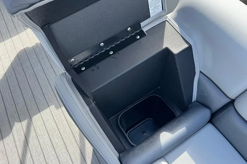 Slide: The Image of 2026 Bentley Pontoons Elite 253 Swingback storage compartment, open with visible interior. - 15