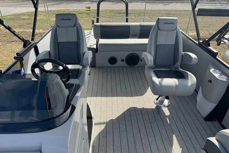Slide: The Image of 2026 Bentley Pontoons Elite 253 interior with dual captain seats and modern design. - 21