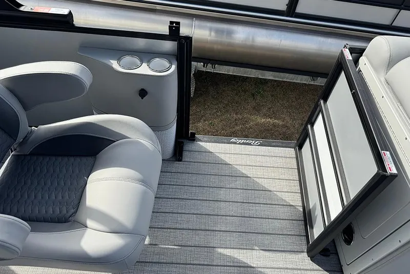 Slide: The Image of 2026 Bentley Pontoons Elite 253 interior with dual captain seats and cup holders. - 27