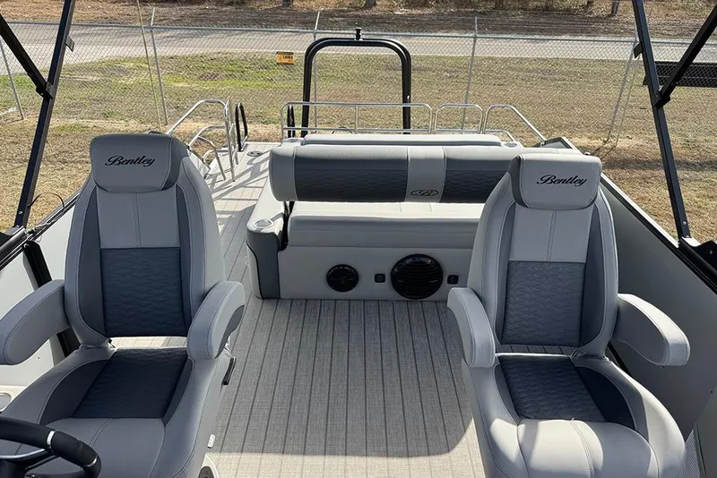 Slide: The Image of 2026 Bentley Pontoons Elite 253 interior with dual captain seats and swingback design. - 30