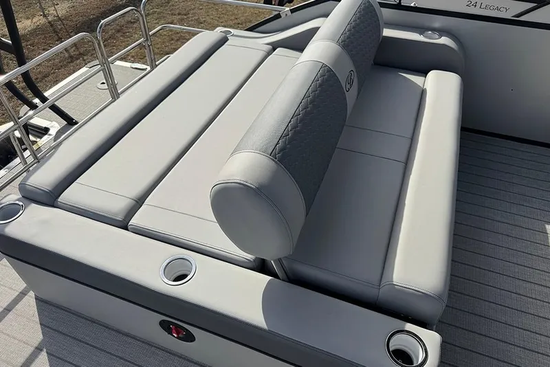 Slide: The Image of 2026 Bentley Pontoons Elite 253 Swingback Dual Captain Full Tritoon seating area with cup holders. - 33