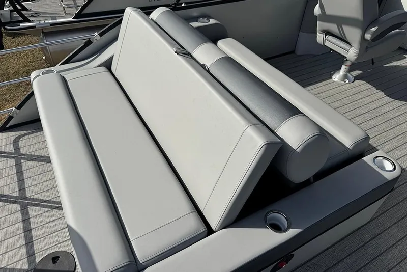 Slide: The Image of 2026 Bentley Pontoons Elite 253 Swingback Dual Captain Full Tritoon seating area, featuring luxurious gray upholstery. - 34