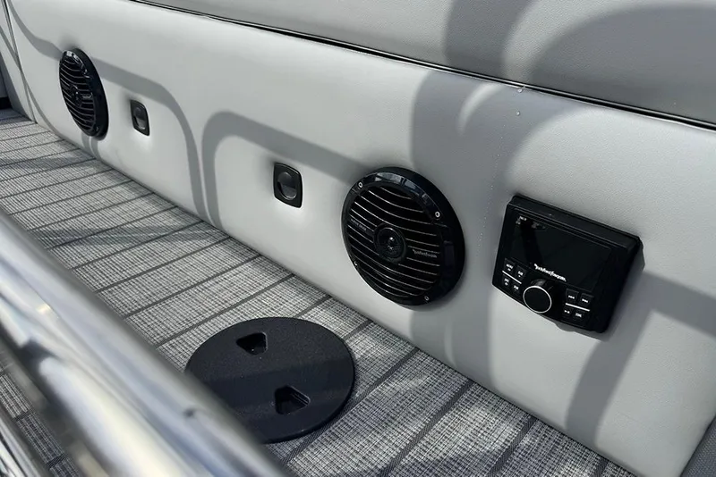 Slide: The Image of 2026 Bentley Pontoons Elite 253 interior with audio system and speakers. - 38