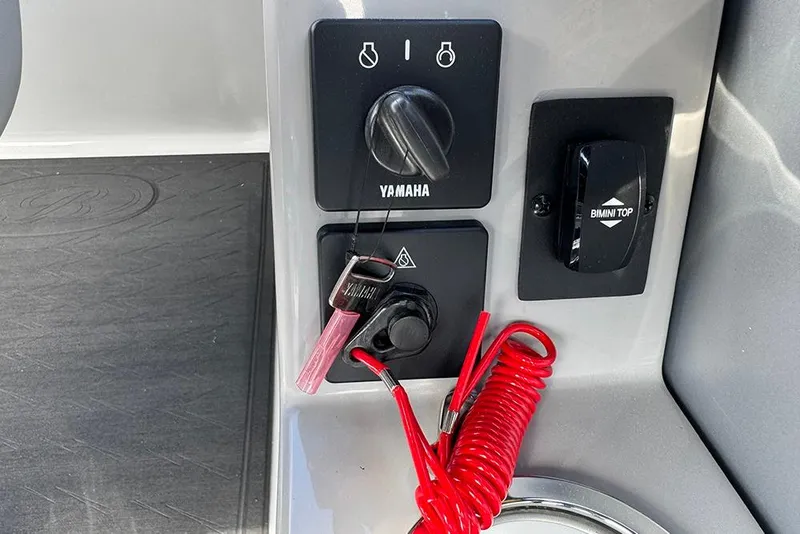 Slide: The Image of Control panel of 2026 Bentley Pontoons Elite 253 with Yamaha ignition and Bimini top switch. - 39