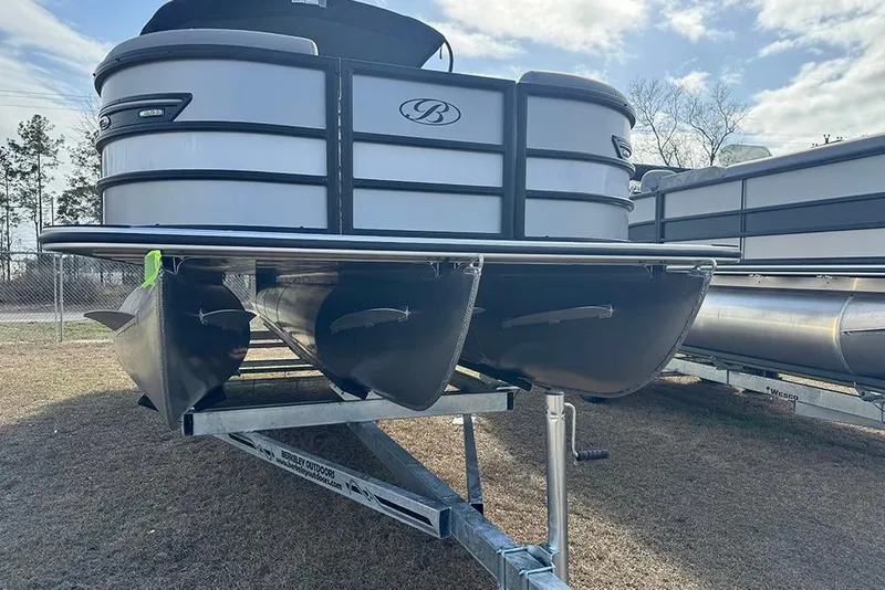 Slide: The Image of 2026 Bentley Pontoons Elite 253 Swingback Dual Captain Full Tritoon on trailer, side view. - 5