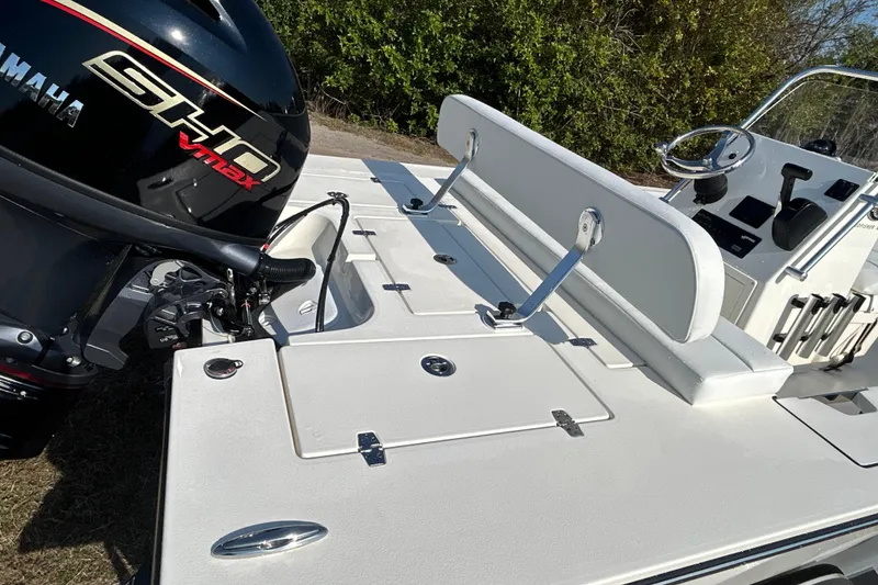 Slide: The Image of 2026 Hewes Redfisher 16 boat with Yamaha SHO VMAX engine, featuring sleek white deck design. - 11