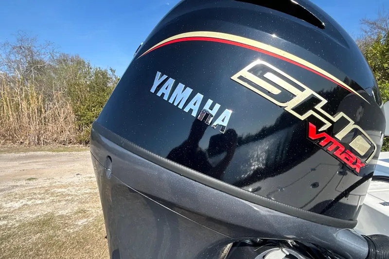 Slide: The Image of Yamaha SHO VMAX engine on 2026 Hewes Redfisher 16 boat, outdoor setting. - 12