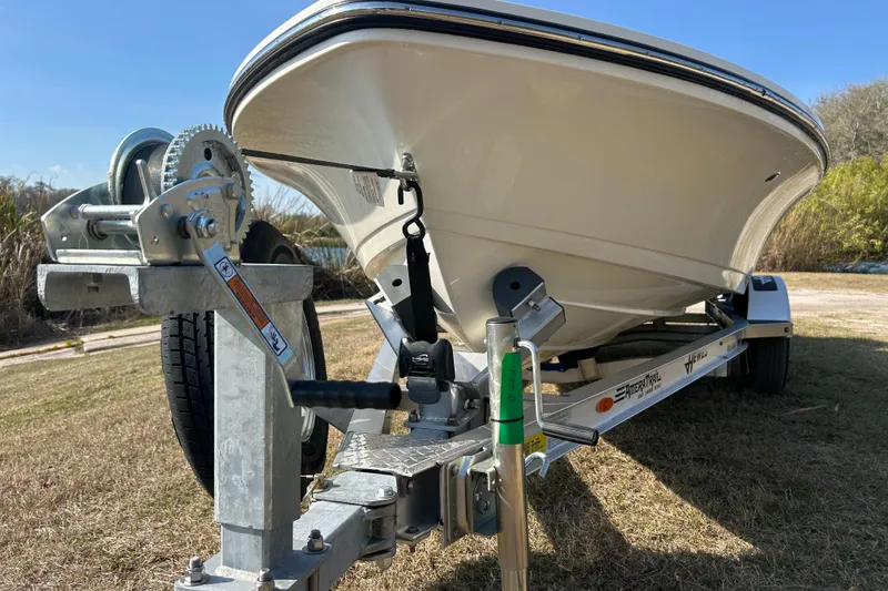 Slide: The Image of 2026 Hewes Redfisher 16 boat on trailer, close-up view of bow and winch. - 4