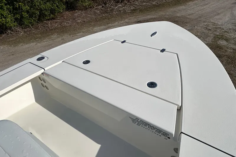Slide: The Image of 2026 Hewes Redfisher 16 boat deck, featuring storage compartments and sleek design. - 7