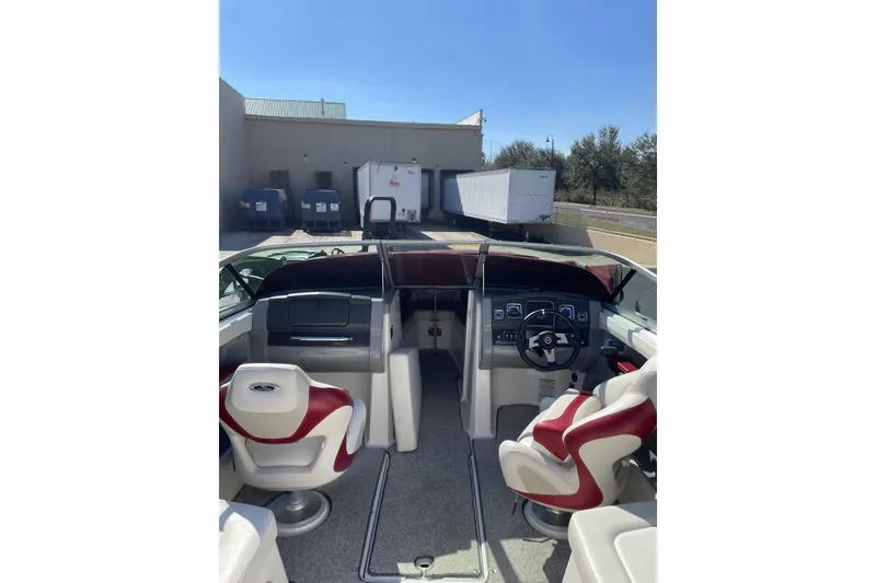 Slide: The Image of Interior view of 2013 Chaparral 226 SSi boat with red and white seating. - 2
