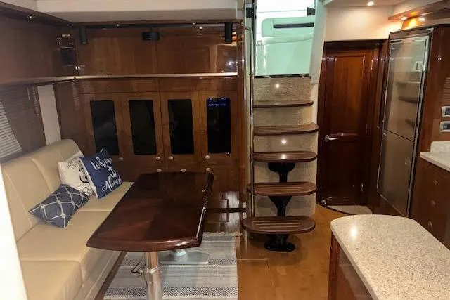 Slide: The Image of Interior of 2008 Sea Ray 48 Sundancer yacht with elegant wood finishes and modern amenities. - 10