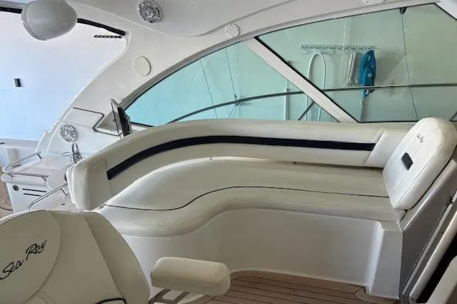 Slide: The Image of 2008 Sea Ray 48 Sundancer interior with white leather seating and modern design. - 14